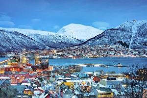 Roof Prints: Dusk over snowcapped mountains and Tromso skyline, Norway
