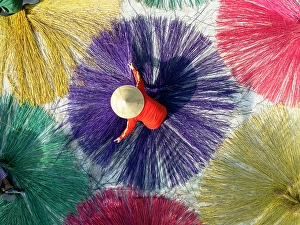 Hoi An Prints: Dyed sedge for sleeping mats being laid out to dry in the sun, Hoi An, Central Vietnam