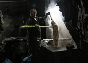Silk Prints: Dyer dying silk in the ancient dyer's souk (Souk des teinturiers)