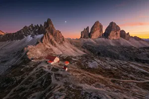 An early autumn sunset over the Locatelli Hut, Monte Paterno and Tre Cime di Lavaredo, Dolomites, Italy