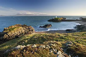 Anglesey Prints: Early evening view of Pilots Cove and the beacon lighthouse T?r Bach on Llanddwyn Island