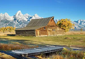 Early Morning, Moulton Barn, Mormon Row, Historic District in Autumn, Fall Foliage with Grand Teton Mountain Range in the Background Grand Teton National Park Wyoming, USA