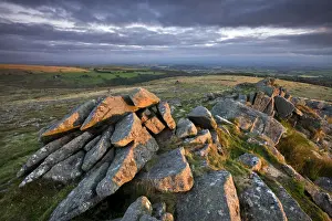 Early morning sunlight lights up the granite rocks of Belstone Tor, Dartmoor, Devon