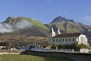 Ecuador, Imbavalu towering above a local Catholic church on the outskirts of Otavalo