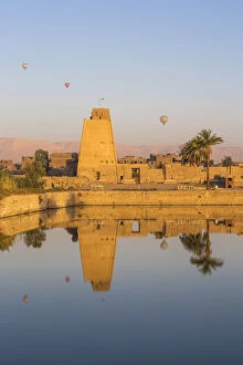 Archaeological Collection: Egypt, Luxor, Karnak Temple, Hot air balloons rise over the Sacred Lake