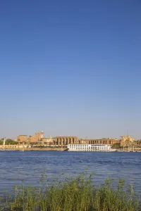 River Nile Prints: Egypt, Luxor, View of cruise boat infront of Luxor temple