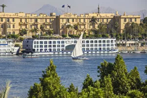 Images Dated 12th June 2017: Egypt, Luxor, View of Nile cruise boats infront of The Winter Palace Hotel