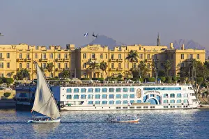 Winter Palace Prints: Egypt, Luxor, View of Nile cruise boats infront of The Winter Palace Hotel