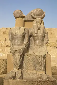 Egypt, Luxor, West Bank, The temple of Ramesses 111 at Medinet Habu, Two statues in