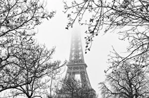 The Eiffel Tower in fog, Paris, France
