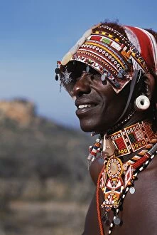 Adornment Collection: Elaborate headdress and body adornments worn by Samburu moran