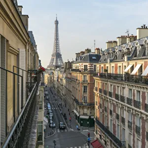 Elevated street view with Eiffel Tower in the background, Paris, France