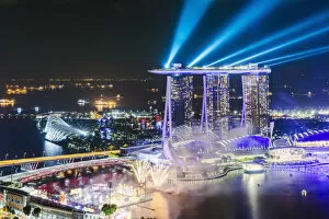 Images Dated 31st October 2018: Elevated view of business district and Marina bay Sands at night, Singapore
