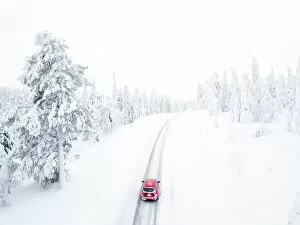 White Gallery: Elevated view of car along the snowy road in the icy forest, Pallas-Yllastunturi