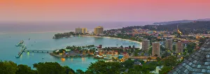 Elevated view over city & coastline illuminated at sunset, Ocho Rios, St. Ann Parish Elevated view over city & coastline illuminated at sunset, Ocho Rios, St. Ann Parish