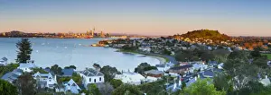 Elevated View Over Devenport towards Central Business District illuminated at sunrise, Auckland, New Zealand