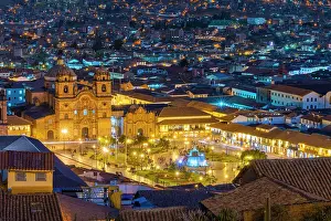 Cusco Province Prints: Elevated view of illuminated Church of the Society of Jesus and Plaza de Armas Square at twilight