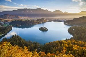 Images Dated 20th October 2014: Elevated view over Lake Bled & the Julian Alps illuminated at Sunrise, Lake Bled