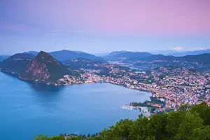 Ticino Prints: Elevated view over Lugano from Monte Bre illuminated at sunrise, Lugano, Lake Lugano