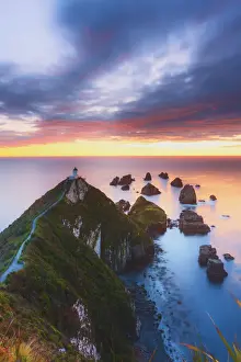 Elevated view of Nugget Point lighthouse in the Catlins national park at sunrise