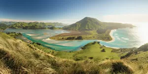 Elevated view of the Otago Peninsula near Dunedin with the sun rising on Hoopers inlet