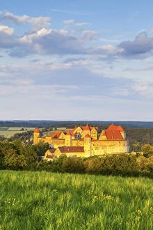 Elevated view towards the picture-perfect Harburg Castle illuminated at sunset, Harburg