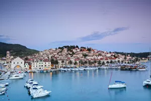 Images Dated 26th August 2014: Elevated view over the picturesque harbour town of Hvar illuminated at dusk, Hvar