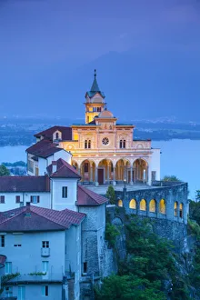 Elevated view over the picturesque Sanctuary of Madonna del Sasso illuminated at dusk Elevated view over the picturesque Sanctuary of Madonna del Sasso illuminated at dusk