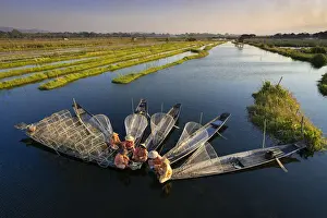Hats Prints: Elevated view of traditional fishermen on Lake Inle having a supper on boats together