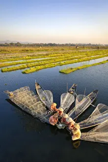 Elevated view of traditional fishermen on Lake Inle having a supper on boats together