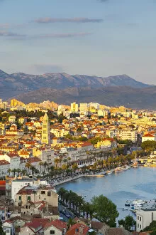 Former Yugoslavia Collection: Elevevated view over the picturesque harbour city of Split illuminated at sunset, Split