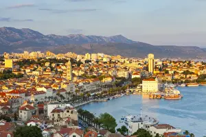 Elevevated view over the picturesque harbour city of Split illuminated at sunset