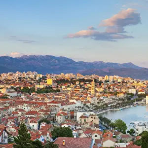 Elevevated view over the picturesque harbour city of Split illuminated at sunset, Split