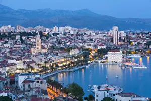 Croatia Prints: Elevevated view over Stari Grad & harbour illuminated at dusk, Split, Dalmatia, Croatia