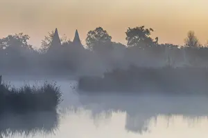 Housing Prints: England, Kent, Converted Oast Houses aka Oasts and Lake with Morning Mist near Tunbridge Wells
