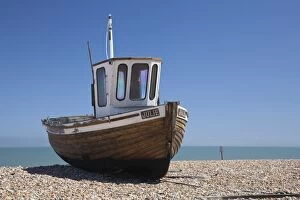 England, Kent, Deal. Old wooden fishing boat on the shingle beach at Deal
