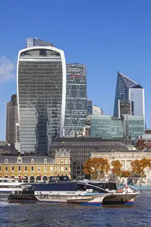 City Skyline Prints: England, London, City of London Skyline and River Thames with Thames Clippers Uber Boat in the Foreground