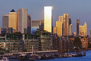 Apartments Prints: England, London, Docklands, Late Evening Light on Canary Wharf Skyline and River Thames