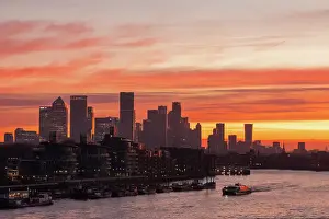 England, London, Docklands, River Thames and Canary Wharf Skyline at Dawn