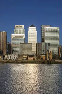 Images Dated 7th April 2021: England, London, Docklands, River Thames and Warm Early Morning Light on The Modern Canary Wharf
