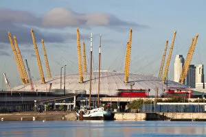 Images Dated 20th November 2009: England, London, Newham, Royal Victoria Docks, Red double decker buses passing infront