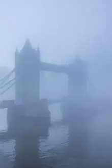 England, London, River Thames and Tower Bridge in the Early Morning Mist