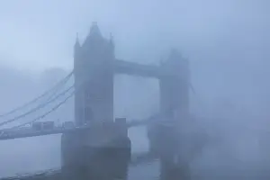 England, London, River Thames and Tower Bridge in the Early Morning Mist