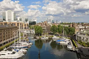 England, London, St Katherines Dock with Canary Wharf in the background