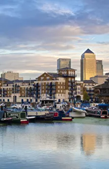 England, London, Tower Hamlets, Limehouse Basin with Canary Wharf buildings in background