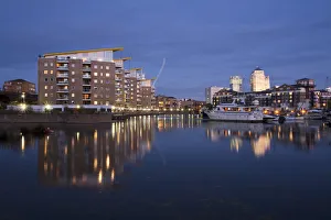 England, London, Tower Hamlets, Limehouse Basin with Canary Wharf buildings in background