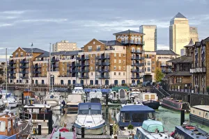 England, London, Tower Hamlets, Limehouse Basin with Canary Wharf buildings in background