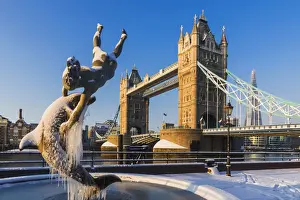 England, London, Tower Hill, The Girl with a Dolphin and Tower Bridge in the Snow