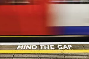 Sign Gallery: England, London, The Underground, Mind the Gap Sign and Moving Train