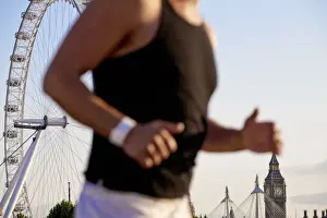 Jogger Prints: England, London, Westminster, Man jogging with The London Eye & Big Ban